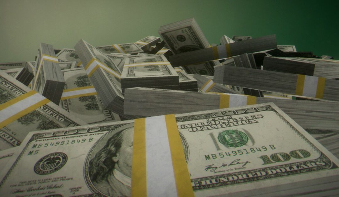 Pile of 100 dollar bill bundles